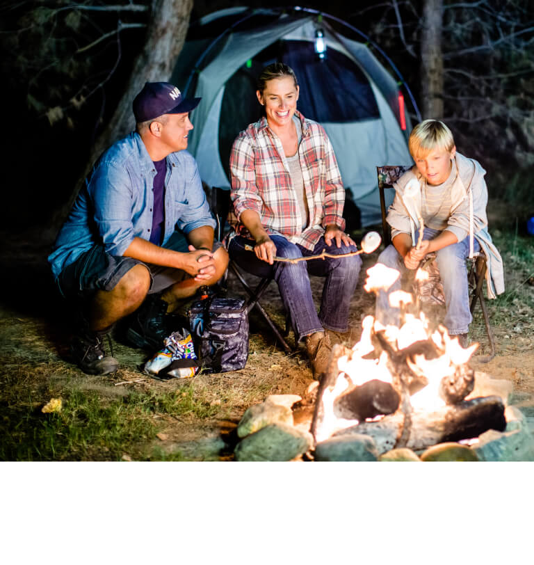 Happy military family at a campsite on vacation