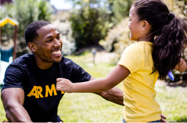 Young military father opening arms to his daughter