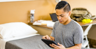 Military soldier browsing with tablet