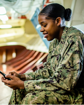 Military woman texting