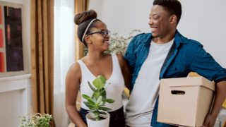 A couple organizes their belongings.