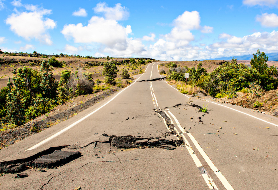 An earthquake causes cracks in a highway.